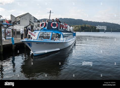 Tourists About To Set Off On A Boat Tour Round Windermere In The Lake District National Park