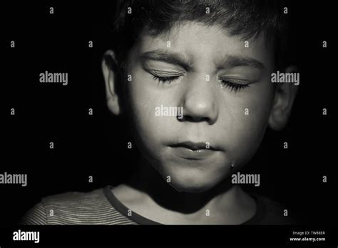 Sad Little Boy On Black Hi Res Stock Photography And Images Alamy