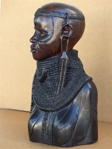 A Statue Of A Person Wearing A Headdress