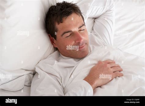 Man Sleeping Peacefully In Bed Stock Photo Alamy