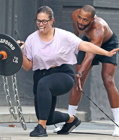 ashley graham looks laid back in crop tee while working out with shirtless husband justin ervin