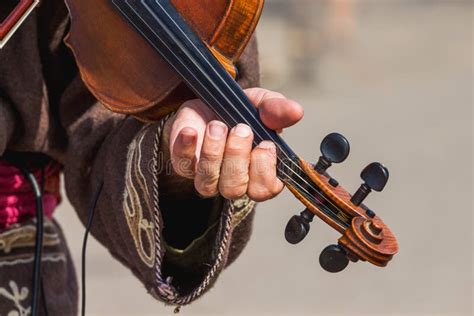 Violinist S Hand With A Violin While Performing A Music Play Stock