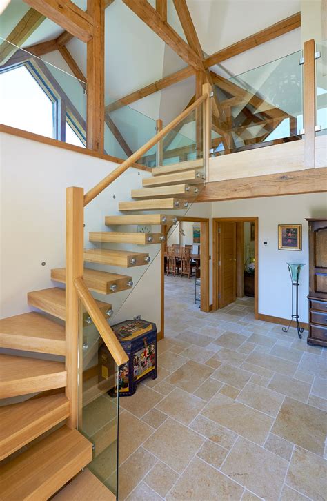 View Of The Contemporary Cantilevered Oak Staircase With Glass