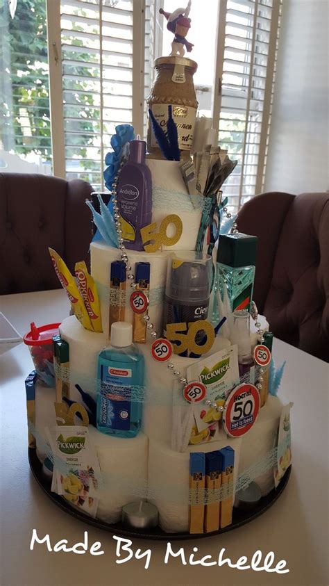 A Birthday Cake Made To Look Like It Has Various Items On The Top And Sides