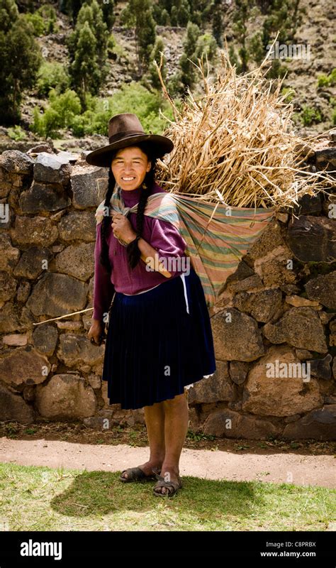 Young Peruvian Woman Carrying A Straw Bail Puno Peru Stock Photo Alamy