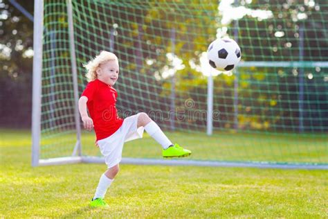Kids Play Football Child At Soccer Field Stock Photo Image Of