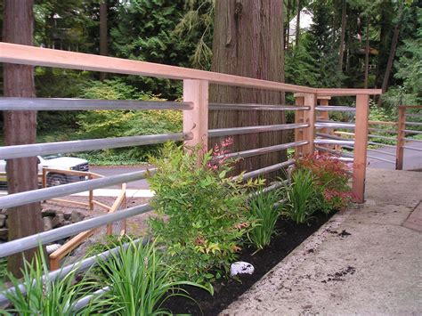 These railings contain wooden posts and anodized horizontal pipes of different diameters. 100s of Deck Railing Ideas and Designs | Railings outdoor ...