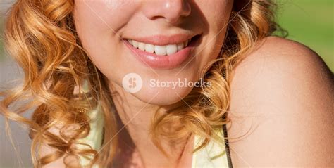 Close Up Face Of Unrecognizable Blond Woman With Curly Hair In Yellow
