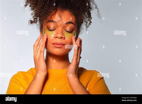 Skincare Concept Young Calm African American Woman Enjoying Beauty Routine Applying Hydrogel