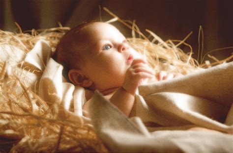 A Close Up Photo Of Baby Jesus In The Manger Shot For A Special