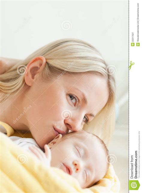 Lovely Mother Kissing Her Sleeping Baby Stock Image - Image of indoors ...
