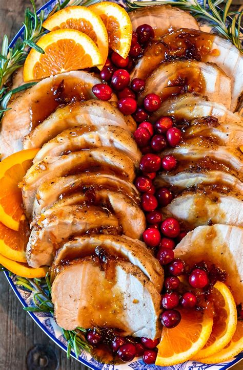 this pork loin roast recipe is the perfect holiday main dish this orange cranb… christmas