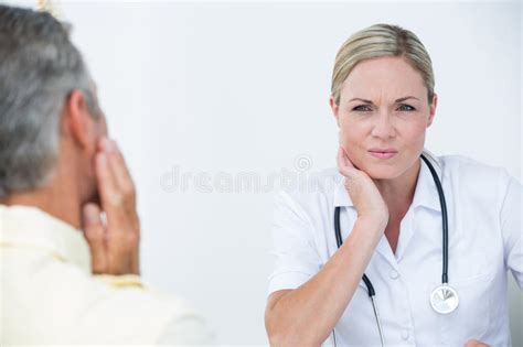 Doctor Examining Patient With Neck Ache Stock Image Image Of Clinic