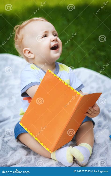 Little Baby Reading Book In Park Stock Image Image Of Leisure Grass