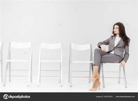 Woman Sitting With Legs Crossed