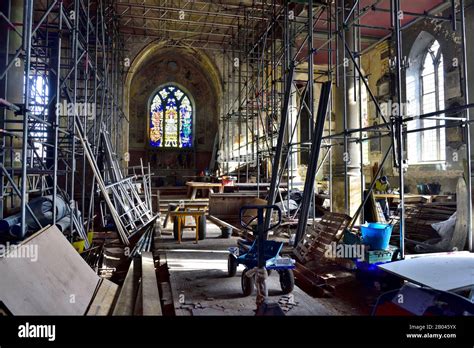 Restoration Building Site With Interior Scaffolding And Tools In Old