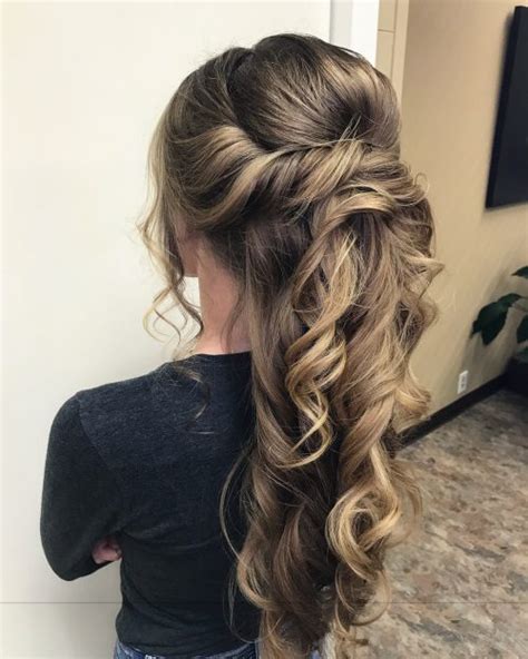 Braids, buns, and whimsical—could be one, two or all three mixed together. 30 Prettiest Prom Updos for Long Hair for 2020