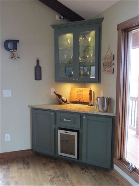 The countertop here is extended from the kitchen cabinets to form a floating peninsula breakfast bar. 49+ Top Corner Bar Cabinet Ideas for Coffee and Wine ...