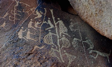 The Ancient Aboriginal Rock Carving Known As Climbing Man Believed