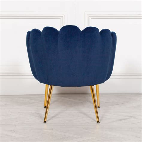 Use a blue living room chair to coordinate your seating with your aesthetic. Aurora Art Deco Navy Blue Velvet Scalloped Occasional ...