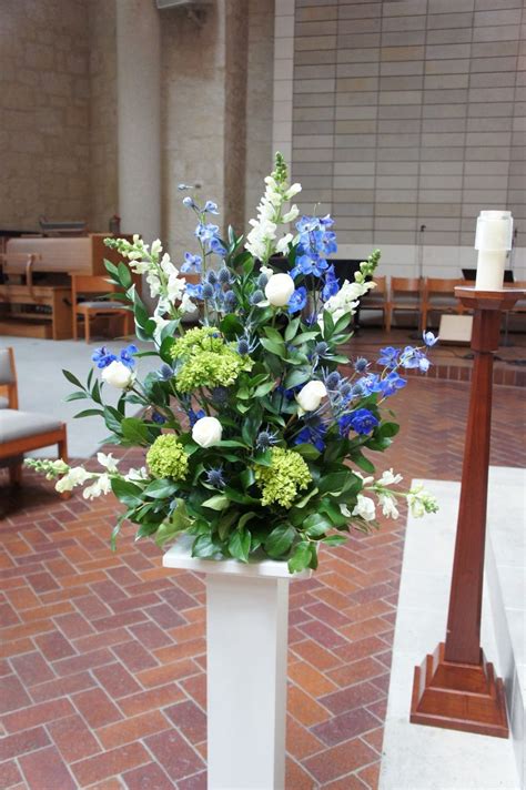 We get it, you're planning a wedding for the first time and flowers are confusing. Blue altar arrangement | Memorial flowers, Church flowers ...
