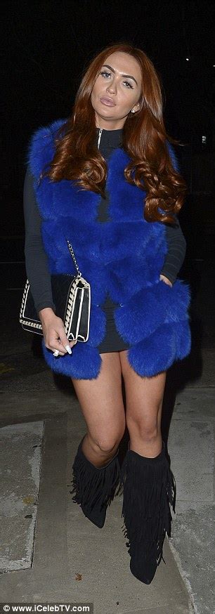 Charlotte Dawson Sizzles In Electric Blue Gilet And Knee High Boots In
