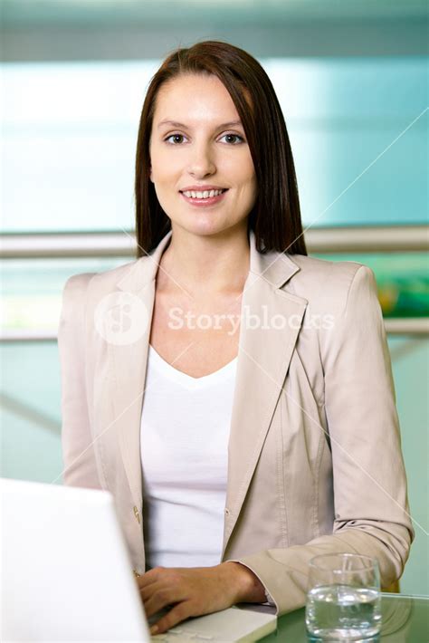 Portrait Of Confident Employee Working With Laptop Royalty Free Stock