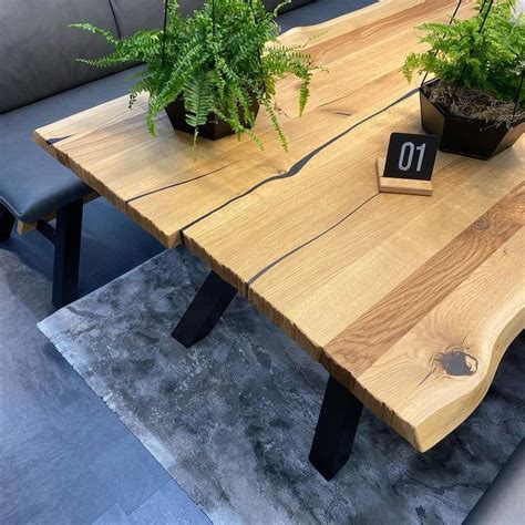 A Wooden Table With Plants On It And A Number 10 Sign In Front Of It