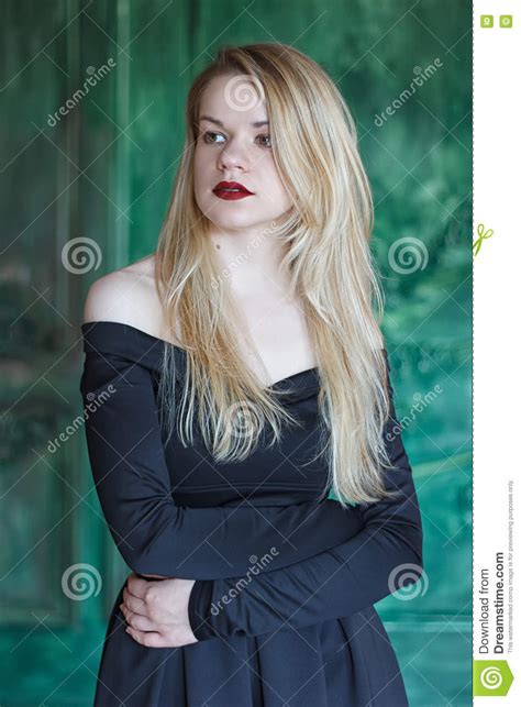 Elegant Blonde In A Black Dress Near Grunge Wall Stock Image Image Of