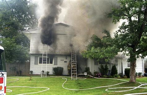 Smoke Pours Out A Door Of A House On Fire In Adelphi Maryland