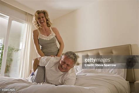 Couple Wrestling In Bed Photos And Premium High Res Pictures Getty Images