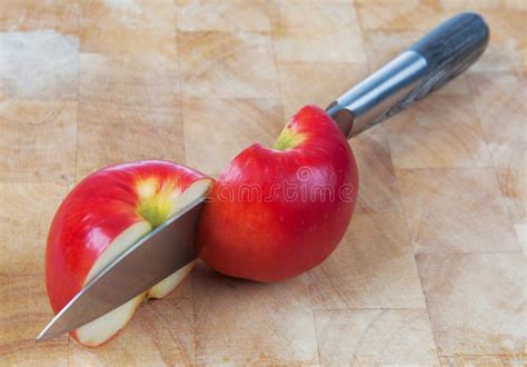 Knife Cutting An Apple On Chopping Board Stock Photo Image Of Metal