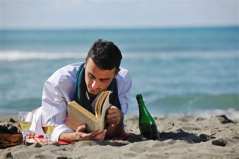 Man Reading Book At Beach Amreading