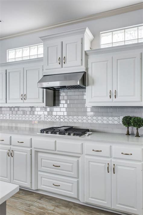 Modern grey cabinets have taken over as the most popular choice over the past 5 years. Grey and white kitchen. White cabinets with grey subway ...