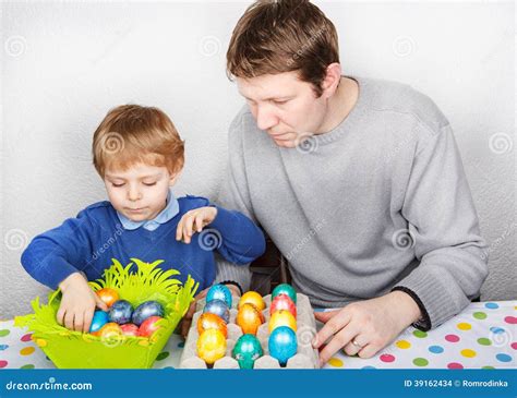 Little Boy And His Mother Being Happy About Selfmade Easter Eggs Stock