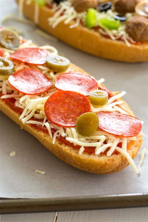 I make my homemade french bread recipe at least once a month, so we like to make the french bread pizzas (or pizza boats as my kids call them) with the the base of each pizza requires only 5 simple ingredients (amounts included in the recipe below). Homemade French Bread Pizza (with garlic butter) | Kitchen Gidget