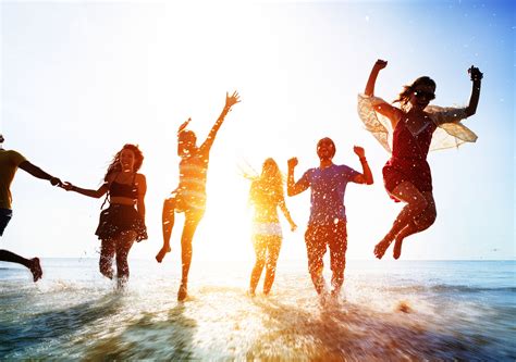 Friends Playing In The Water At The Beach Active Atoms