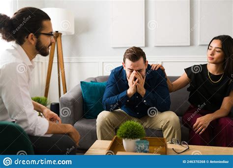 Depressed Husband At Couples Therapy Stock Photo Image Of Unhappy