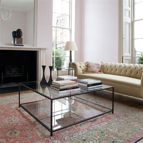 Scattered about in different shapes and sizes, candles can help break up a coffee table's sheer size. 10 Collection of Glass Coffee Table Decorating