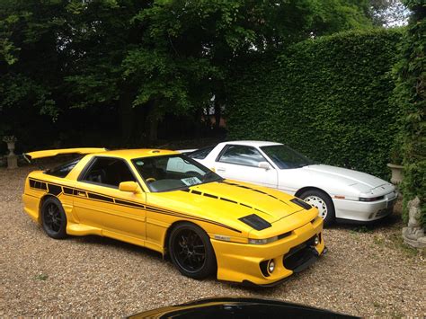 This is duane's mk3 toyota supra that makes 1036hp at the rear wheels. mk3-supra-yellow-and-white - Panic Mechanic