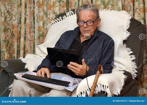 Old Man Working With Laptop Computer At Home Stock Image Image Of