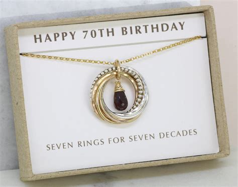 This theme focuses on the celebrant's life from birth till her 70th birthday. 70th birthday gift for women garnet necklace for January