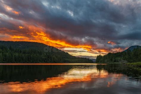 Amazing Orange Sunset Over Lake With Reflection At Inland Lake