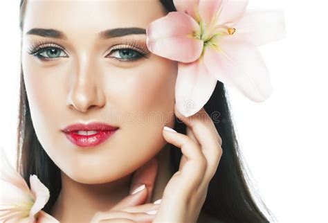 Young Attractive Lady Close Up With Hands On Face Flower Lily Brunette