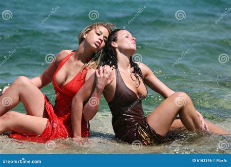 Two Girls Getting Wet In Water Royalty Free Stock Image Image