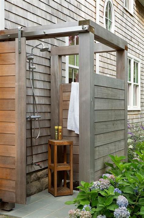 Gray Teak Outdoor Shower With Plank Sliding Barn Door On Rails