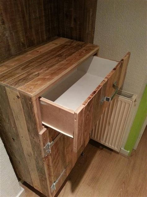 Join the pallet woods to make the different spaces with adding doors at the lower part. Storage Cabinets Made Out of Pallets | 101 Pallets