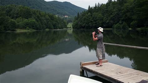 Young Man Fishing From A Dock Stock Footage Video 3887267 Shutterstock