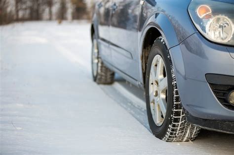 Premium Photo Close Up Of A Car Tire Parked On Snowy Road On Winter