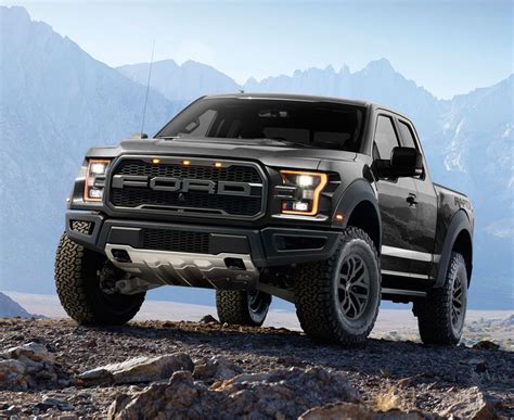 Couple sitting in pick up truck on camping holiday. 2017 Ford F-150 Raptor Pick-Up Truck (Black) | Ford raptor ...